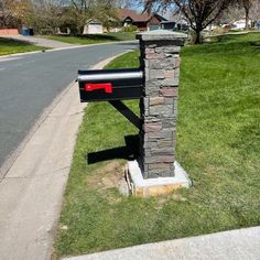 the mailbox is on the side of the road