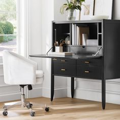 a black desk with a white chair in front of it