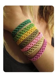 a woman wearing bracelets made from crocheted yarn