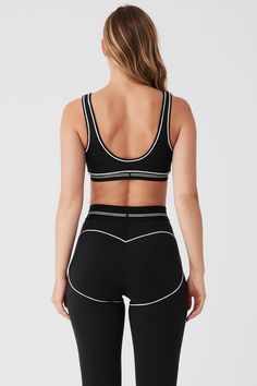 Way too cute to cover up. This bra features contrasting stitching, a gently-scooped neck and a low back, all done in our signature Airbrush fabric for a soft and comfortably compressive fit. It’s perfect for medium-intensity workouts like dance, yoga or Pilates, and even cuter with the matching Heart Throb Legging. Alo Yoga Black Sports Bra With Built-in Bra, Black Padded Activewear For Yoga, Black Sporty Fitted Bra, Sporty Fitted Black Bra, Sporty Bra-friendly Activewear By Alo Yoga, Black Sporty Bra, White Padded Fitted Sports Bra, Contrast Trim Activewear For Workout, Sporty Alo Yoga Crop Top For Sports