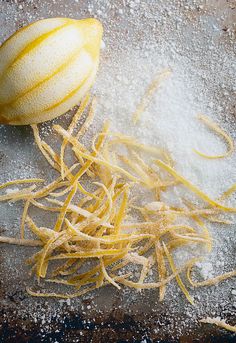 some food that is on a table with powdered sugar and other things around it