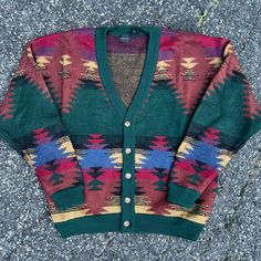 Vintage Crazy Pattern Cardigan Button Up Sweater Knit Sweatshirt. Great Design On This One. Measures 25x27.5. Please Check Measurements Before Purchasing. I Do My Best To Show Any Flaws In Pictures. Quick Shipping! Bundles Encouraged! @Ants_haul On Instagram. Green Cotton Sweater With Button Closure, Casual Wool Polo Sweater With Buttons, Classic Winter Sweater With Snap Buttons, Casual Knit Sweater With Button Cuffs, Multicolor Wool V-neck Sweater, Multicolor Button-up Winter Sweater, Casual Wool V-neck Sweater With Button Closure, Casual Multicolor Wool Cardigan, Winter Green Tops With Snap Buttons