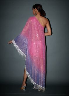 Introducing our ombre crystal embellished one-shoulder kaftan with rhinestones fringe and cascading hem. This mesmerizing kaftan combines style and drama, with an ombre design and intricate crystal embellishments that catch the light. The rhinestones fringe adds a playful touch, and the cascading hem ensures you make a grand entrance at any event. Embrace elegance and grace with this exquisite kaftan. One Shoulder Kaftan, Work Crystals, Ombre Design, Grand Entrance, Indian Ethnic Wear, Pink Ombre, Crystal Embellishment, Designer Wear, Personal Stylist