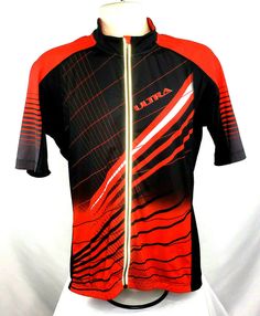 a red and black shirt with white lines on the front, along with an orange stripe across the chest