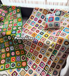 a crocheted blanket and pillow are sitting on a couch with the cover pulled over