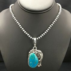 Navajo Sterling Silver Kingman Turquoise Necklace Pendant Yazzie Ln 20 2539 The Native American Blue Kingman Turquoise Necklace And Pendant Has A Beautiful Matrix, With A Strand Of Silver Beads Add This Signed Pendant Necklace A Class Of Its Own. Free Gift Velvet Pouch With Purchase. Jewelry Type: Necklaces Length: 20" Pendant: 1.3” X 2.8” With Bail Main Stone: Turquoise Material: Stone Metal: Sterling Silver Artisan: Bennett And Dreama Yazzie Made In Usa Navajo Beaded Necklace, Necklaces Length, Navajo Jewelry, Kingman Turquoise, Velvet Pouch, Blue Necklace, Turquoise Pendant, A Class, Silver Blue