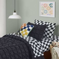 a black and white checkered comforter on a bed