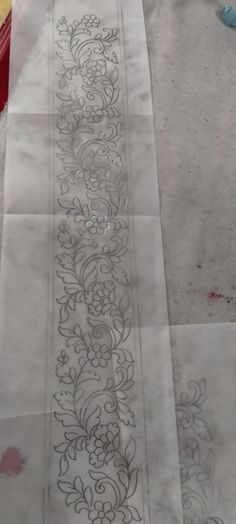 a piece of paper that has some designs on it