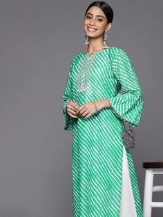 This is a single piece kurta. It comes with straight shape kurta comes with floral print detailing has round neck, 3/4th sleeves & calf length. Single Piece Color-Green Suit Fabric-Cotton Work - Leheriya Print & Gota Patti Detailing Neck-Round Neck Sleeves-3/4th Flared Sleeves Kurta Length - Calf Length Washing Care - Hand Wash Size worn by the model: Small Height: 5'7" Festive Kurta With 3/4 Sleeves, Festive Kurta With Printed Motifs And 3/4 Sleeves, Festive Kurta With 3/4 Sleeves And Printed Motifs, Festive 3/4 Sleeve Kurta With Printed Motifs, Festive Kurta With 3/4 Sleeve For Eid, Spring Anarkali Kurta With Long Sleeves, Festive 3/4 Sleeve Kurta For Eid, Semi-stitched Long Sleeve Kurta For Spring, Spring Printed Salwar Kameez With Straight Kurta