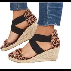 Leopard Print. Black Stretch Bands Cross Over Top Of Foot. Zipper Back. Espadrilles. Wedge. Size 8. Never Worn. New. Cute With Your Fav Jeans. Black Wedge Sandals With Round Toe For Vacation, Casual Espadrille Wedge Slip-on Sandals, Casual Brown Wedge Sandals With Round Toe, Casual Espadrille High Heel Wedge Sandals, Casual High Heel Espadrilles For Summer, Casual Brown Wedge Sandals For Summer, Casual Platform Heels In Espadrille, Trendy Espadrille Wedge Sandals With Round Toe, Trendy Closed Toe Espadrille Wedge Sandals