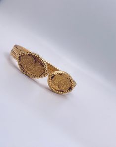 This Traditionally hand-crafted cuff bracelet in lustrous gold purity stands testament to its impeccable quality and artistry. a timeless piece of treasure in 37.20 grams of 21k gold Traditional Hallmarked Yellow Gold Cuff Bracelet, Traditional Heavy Gold Cuff Bracelet, Traditional 22k Yellow Gold Cuff Bracelet, Ornate Yellow Gold Cuff Bracelet With Intricate Design, Luxury Gold Tarnish-resistant Cuff Bracelet, Timeless Pieces, Cuff Bracelet, Hand Crafted, Fine Jewelry