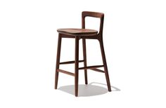 a wooden bar stool with a bent backrest and seat upholstered on an isolated white background