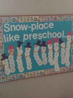 a bulletin board with snow - place like preschool written in white letters on it