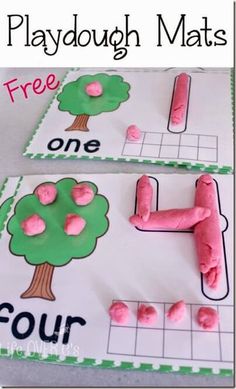 two playdough mats with pink and green trees on them, one is for four