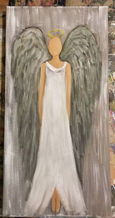 an angel painted on canvas with white paint