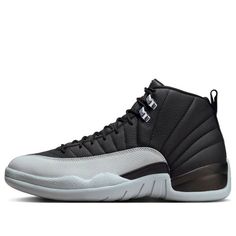 The Air Jordan 12 'Black Wolf Grey' is a striking iteration of Michael Jordan's iconic sneaker, blending understated elegance with a touch of rugged sophistication. Released as part of Jordan Brand's extensive lineup, this model features a sleek black leather upper that exudes both durability and luxury. The shoe's signature tumbled leather is complemented by a distinctive Wolf Grey overlay, which adds a contemporary contrast while maintaining a refined aesthetic.The 'Black Wolf Grey' also incor Modern Black High-top Sneakers With Boost Midsole, Carbon Color Sneakers With Boost Midsole For Streetwear, Dynamic Black High-top Sneakers With Contrast Sole, Carbon Color Round Toe Sneakers For Streetwear, Carbon Color Sneakers With Rubber Sole For Streetwear, Carbon Color Low-top Leather Sneakers, Black High-top Sneakers With Rubber Sole For Light Sports, Classic Black Custom Sneakers With Studded Outsoles, Black Sporty Basketball Shoes With Studded Outsoles