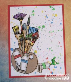 a card with some paint and brushes on it