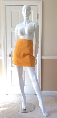 "This vintage Moschino skirt is in his iconic taxi cab/school bus yellow.  Fully lined in yellow rayon.  Side zipper with self button.  Front and back shaping seams.  Measurements -  Waist - 27' Hips - 36\" Length - 18\"" Fitted Retro Style Mini Skirt, Retro High-waist Fitted Mini Skirt, Retro Fitted High Waist Mini Skirt, Retro Fitted High-waist Mini Skirt, Fitted High Waist Retro Mini Skirt, Retro High Waist Fitted Skort, Retro High-waist Fitted Skort, Retro Mini Length Bottoms For School, Retro Fitted Short Skirt