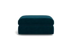 the footstool is made out of blue velvet