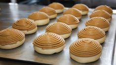 some cookies are lined up on a cookie sheet