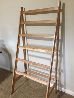 a wooden ladder leaning against the wall