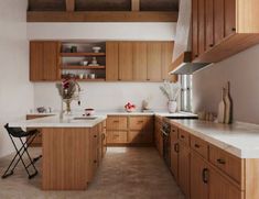 the kitchen is clean and ready for us to use it's natural wood accents