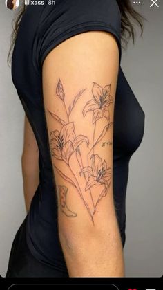 a woman with a flower tattoo on her arm