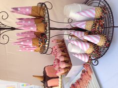 cupcakes and desserts are displayed on a table