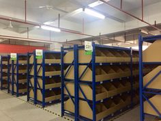 rows of shelves with cardboard boxes on them