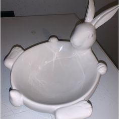 a white ceramic bowl with an animal design on it