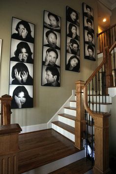 a staircase with multiple pictures on the wall