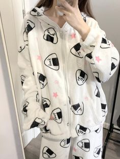 Embrace the charm of Japanese aesthetics with this adorable pajama set, featuring delightful onigiri (rice ball) and star patterns throughout. The top is designed with a cozy hood and a convenient zipper closure, complemented by practical pockets on each side of the placket. The pants boast a comfortable elastic waistband, ensuring a snug fit for a restful night's sleep.  Price includes one pajama set only.   	 		 			Top Size 			S 			M 			L 		 		 			Length 			66.5 			68 			69.5 		 		 			Bust Casual Cartoon Print Sleepwear For Winter, Casual Winter Sleepwear With Cartoon Print, White Cozy Winter Sleepwear, Cozy White Winter Sleepwear, Cute Cotton Hooded Sleepwear, Casual Hooded Sleepwear For Pajama Party, Kawaii Hooded Sleepwear For Sleepovers, Kawaii Winter Sleepwear, Star Print Long Sleeve Sleepwear For Pajama Party