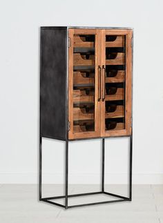 a wooden and metal cabinet with drawers