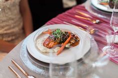 a white plate topped with meat and veggies