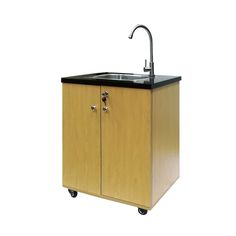 a wooden cabinet with a sink and faucet on it's side, against a white background