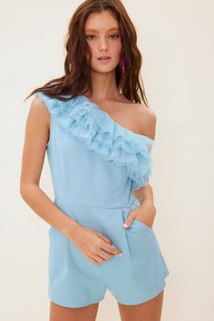 The sweetest little romper featuring one shoulder and pleated tulle detail. Side zipper and pockets. 100% polyester Fitted One-shoulder Jumpsuit With Ruffles, One-shoulder Fitted Jumpsuit With Ruffles, Fitted One-shoulder Ruffled Jumpsuit, Chic One Shoulder Ruffled Jumpsuit, Chic One-shoulder Ruffled Jumpsuit, Spring One Shoulder Ruffled Jumpsuits And Rompers, Spring One-shoulder Ruffled Jumpsuits And Rompers, One-shoulder Ruffled Jumpsuits And Rompers For Spring, Flirty Off-shoulder Jumpsuits And Rompers With Ruffles