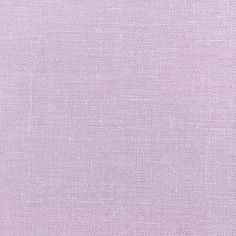 a close up view of a light purple fabric