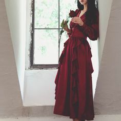 The glossy wine color creates a noble and elegant atmosphere. A drapey dress with a wide waist and decorated with flowing ruffles on the skirt. It has a deep color that is not too bright. Let's go to the ball tonight. 
 
 
 ＜Size＞ 
 
 S size 
 
 
 Length: 122cm 
 Shoulder width: 36cm 
 Bust: 86cm 
 Waist: 66cm 
 Sleeve length: 58cm 
 
 M size 
 
 Length: 124cm 
 Shoulder width: 37cm 
 Bust: 90cm 
 Waist: 70cm 
 Sleeve length: 59cm 
 
 L size 
 
 Length: 126cm 
 Shoulder width: 38cm 
 Bust: 94cm Elegant V-neck Maxi Dress With Ruffled Skirt, Elegant Satin Dress With Ruffled Skirt, Elegant Draped Evening Dress With Ruffles, Party Maxi Dress With V-neck And Ruffled Skirt, Party Maxi Dress With Ruffled Skirt And V-neck, Elegant Maxi Ruffle Dress With Ruffled Skirt, Elegant Ruffle Dress With Maxi Length, Elegant Maxi Length Ruffle Dress, Ruffled Maxi Dress For Banquet In Prom Season