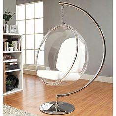 a white swing chair in a living room