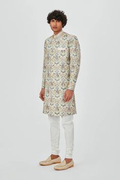 Beige raw silk heavy embellised and appliqued sherwani with churidar. DELIVERY TIMEPlease allow 6-8 weeks for your outfit to arrive. Professional cleaning only.