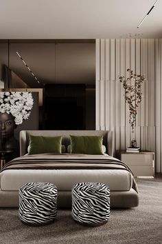 a bedroom with zebra print foot stools in front of the bed