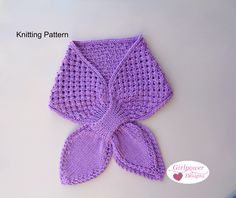 a crocheted purple bow is shown on the table with text that reads, knitting pattern