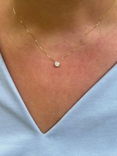 Our solitaire diamond necklace is so dainty and classic, perfect for everyday wear! Information: 💎 Sterling Silver (925 stamped) | 14K Gold Vermeil 💎 High-quality Cubic Zirconia diamond 💎 Carat: 0.25ct | 4.5MM 💎 Adjustable: 16" - 18" 💎 Hypoallergenic 💎 Tarnish resistant If you're looking for a minimalist solitaire necklace, this is a great option. It's bezel setting and high polish makes the necklace classy and perfect for everyday wear. Plus, it's a great starting piece to create gorgeous Fine Jewelry Everyday Necklace With Prong Setting, Timeless Everyday Necklace With Prong Setting, Timeless Prong Setting Necklace For Everyday, Delicate White Diamond Necklace For Everyday, Fine Jewelry Solitaire Necklace With Brilliant Cut For Everyday, Dainty White Solitaire Necklace In 14k Gold, Dainty 14k Gold White Solitaire Necklace, Everyday Fine Jewelry Solitaire Necklace With Brilliant Cut, Anniversary Solitaire Necklace With Delicate Chain In Diamond White