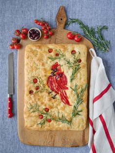 a wooden cutting board topped with a pastry