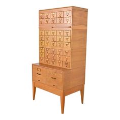 a tall wooden cabinet with drawers on it