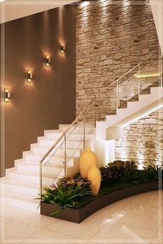 the stairs in this house are decorated with flowers and greenery as well as candles