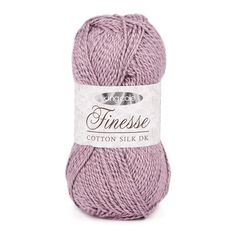 a ball of yarn with the word finesse written on it in white and pink