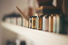 books are lined up on a shelf in a library