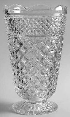 a clear glass vase sitting on top of a table