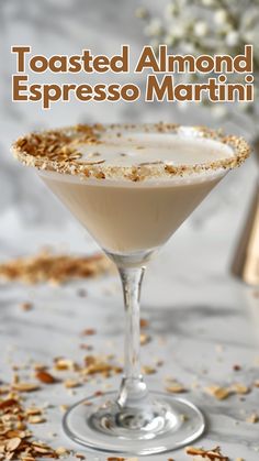 toasted almond espresso martini in a coupe glass garnished with flakes